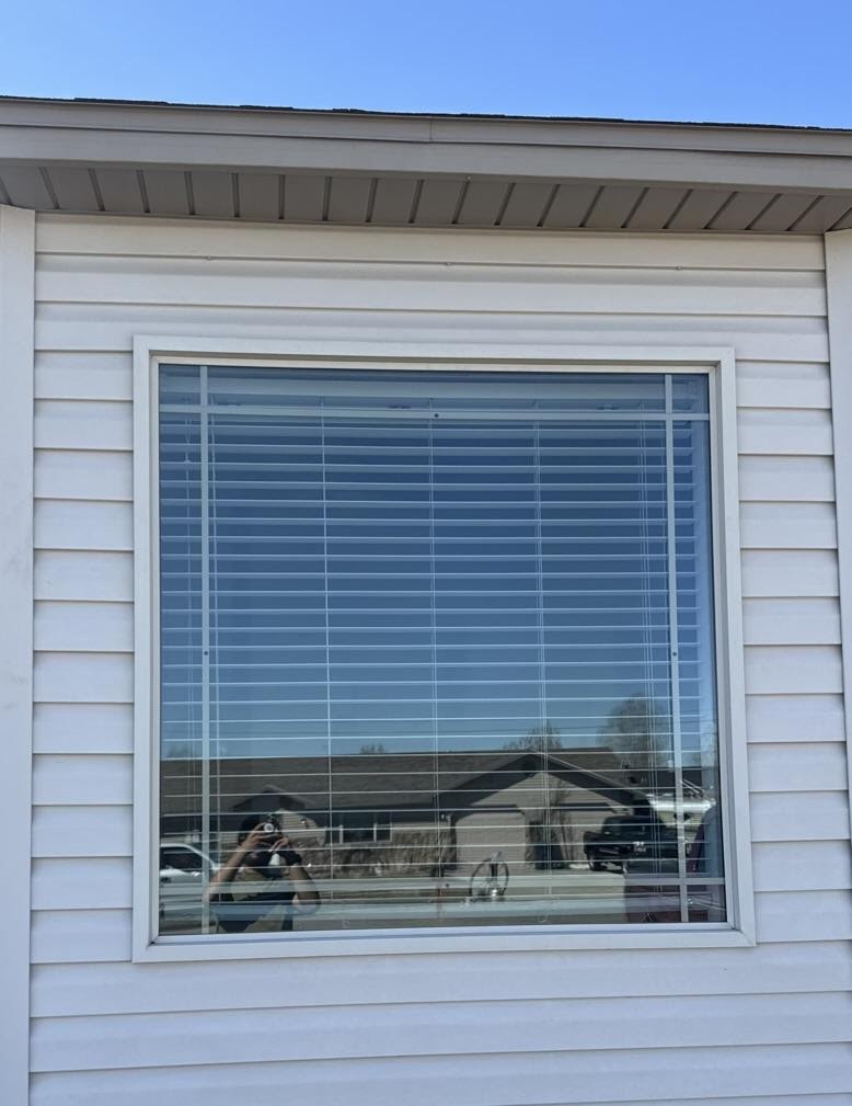 A large spotless picture window cleaned by TrueClear in the Idaho Falls area